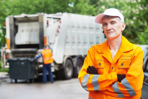 Construction site with builders removing waste